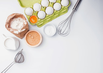Tools and ingredients for baking: flour, eggs, sugar and other.