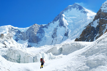 Naklejka na ściany i meble Climber reaches the summit of Everest. Mountain peak Everest. Highest mountain in the world. National Park, Nepal