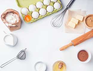 Tools and ingredients for baking: flour, eggs, sugar and other.