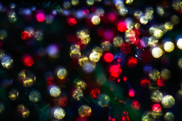 Obraz na płótnie Canvas texture of colored lights on the Christmas tree