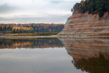 Fototapeta na wymiar autumn forest on the banks of the river