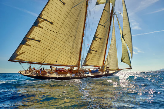 Sports team of yachtsmen is fighting to win the regatta. Sailing yacht race. Yachting