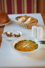Delicious vegetable soup at the table of restaurant or cafe.