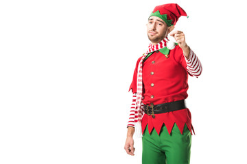 man in christmas elf costume holding bauble and looking at camera isolated on white background