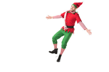 cheerful man in christmas elf costume jumping isolated on white background