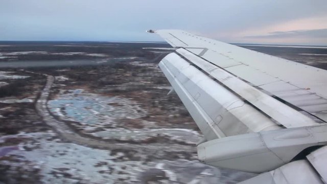 Plane landing at Manitoba Canada Landing from the wing point of view at Manitoba Canada
