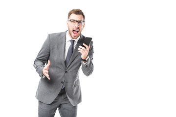 angry adult businessman shouting at smartphone and looking at camera isolated on white