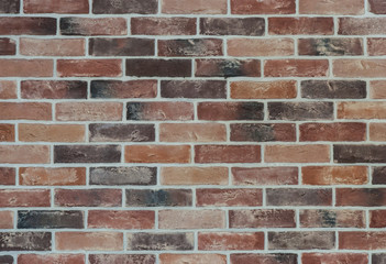 Decorative old brick wall with white seams
