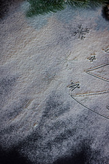 Happy New Year written on a black cutting board with flour