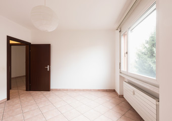 Empty room with door and window
