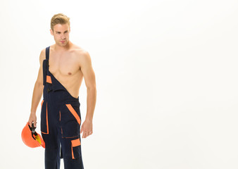 Portrait architect builder, civil engineer working. Builder with hard hat. Foreman, repairman with protective helmet. Construction worker in working uniform. Workman in overalls. Sexy builder concept.