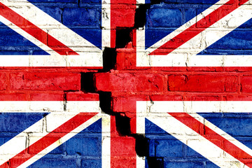 United Kingdom (UK) flag painted on cracked divided brick wall. Concept image for Great Britain, British, England, Brexit, English language and culture and political crisis in the country.