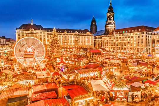 Dresden. Classic view on Dresden Christmas Market. Saxony, Germany, Europe. Christmas Markets with illuminated Christmas Tree and Street Food is Traditional way to celebrate winter holidays in Europe.