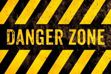 Danger zone warning sign text with yellow and black stripes painted over concrete wall surface facade cement texture background. Concept image for caution, risky dangerous area and hazard. - 233174944