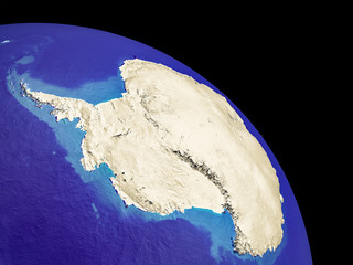 Orbit view of Antarctica with country borders. Plastic planet surface with mountains and blue oceans with waves.