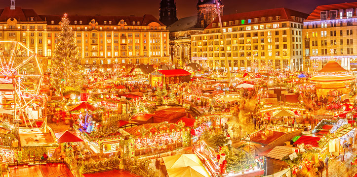 Dresden. Classic view on Dresden Christmas Market. Saxony, Germany, Europe. Christmas Markets with illuminated Christmas Tree and Street Food is Traditional way to celebrate winter holidays in Europe.