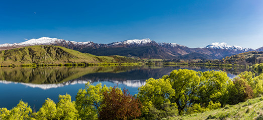 Lake Hayes reflecting Coronet  mountains, near Queenstown, New Zealand