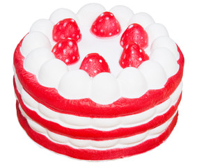 Squishy. Toy cake brownie with strawberries on a white isolated background