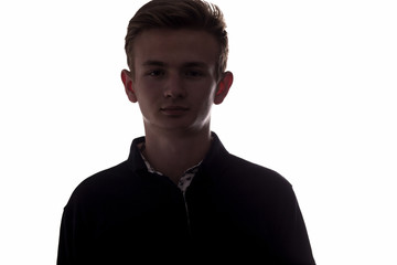 silhouette of an unrecognizable young man, teenager on a white isolated background
