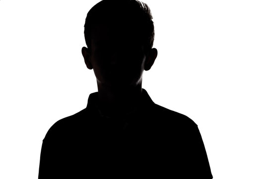 silhouette of an unrecognizable young man, teenager on a white isolated background
