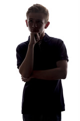 silhouette of a guy man thoughtfully looking upwards on a white isolated background