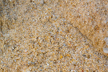 background of gravel and sand space for text here.beach sand and sea stones.