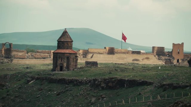 church in ani city and turkey flag