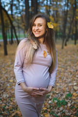 Pregnant Woman with Leaves in Hair