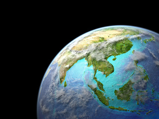 Asia on Earth from space. Very fine detail of planet surface, realistic clouds and visible ocean floor.