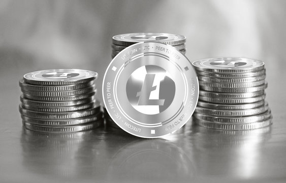Litecoin (LTC) digital crypto currency. Stack of  silver coins. Cyber money.