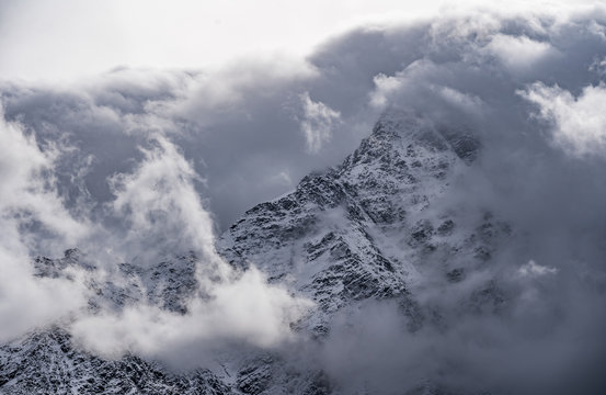 Mountain peeks surrounded in clouds. Concept - mountaineering, mountains, the pursuit of the peaks, the top © filin174
