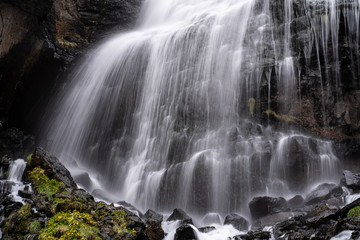 Fototapeta na wymiar A beautiful landscape with mountain waterfall in Terskol. Elbrus area, Kabardino-Balkaria, Russian Federation