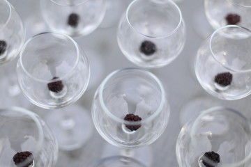 Beautiful transparent wineglasses with berries