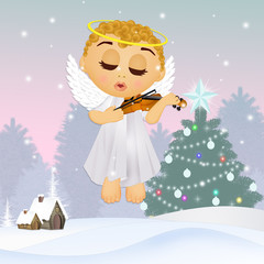 little angel plays the violin at Christmas