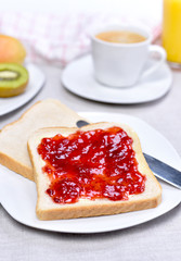 Fresh toast bread or breakfast scene. Healthy fresh fruits and plate with toasts and jam.