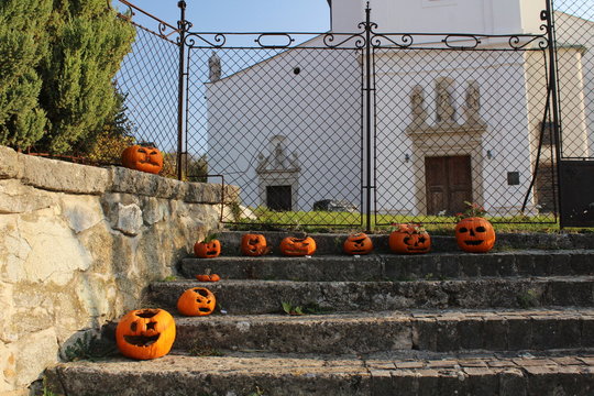 Halloween decorations made of pumpkins in front of a church
