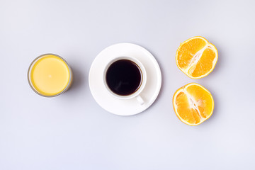 Obraz na płótnie Canvas Group Useful Colorful Beverages Drink Coffee Orange Juice Ripe Oranges Flat Lay Still Life Table Top View Blue Background Minumal Breakfast Concept