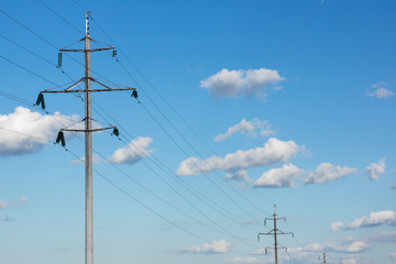 support of power lines against the background of a blue sky