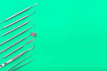 dentist tools on green background