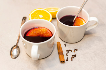 Hot mulled red wine on the concrete table