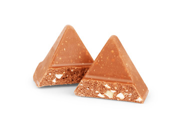 Milk chocolate pieces isolated on white background