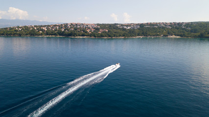 Obraz premium View from the air - powerboat sails to the sea