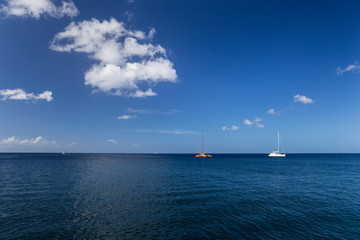 Two yachts and the Caribbean Sea landscape