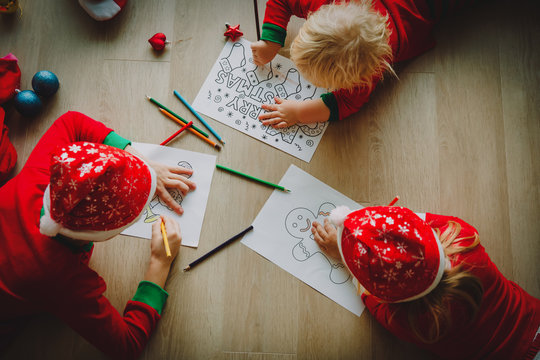 kids making Christmas crafts, draw and colour, family celebration