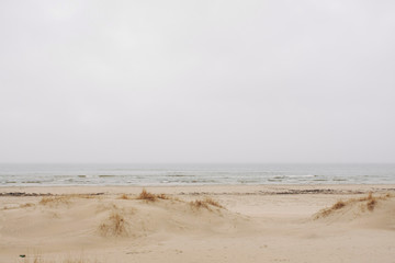 beautiful white dune beach on a grey summer day