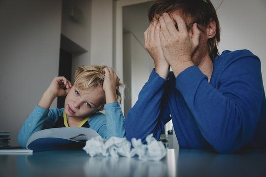 father tired of doing homework with son, difficult learning