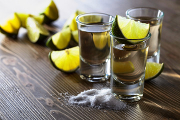 Tequila and lime slices.