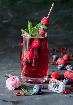 Raspberry lemonade with mint served in glass