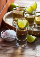 Tequila and lime slices.