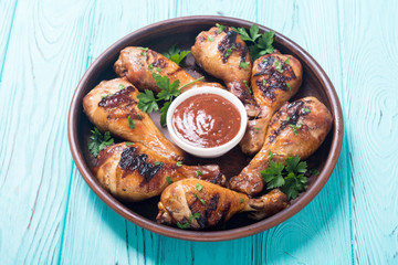 Grilled chicken legs with tomato sauce BBQ food background